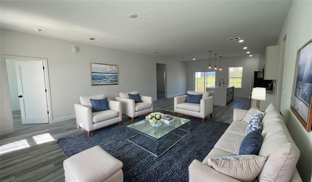 15282 Southwest 65th Avenue Road Ocala, FL 34473 - Photo 9 of 33 a living room with furniture and a wooden floor