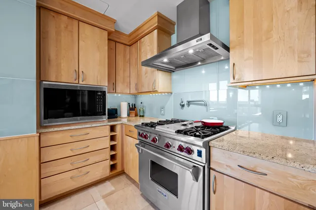 a very nice looking room with a large window and wooden floor