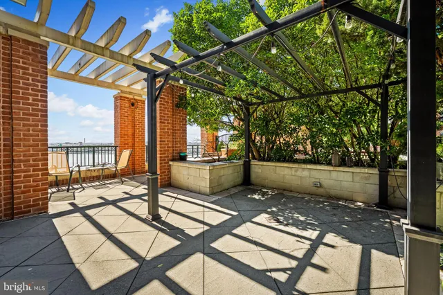 a view of a livingroom with wooden floor and a flat screen tv