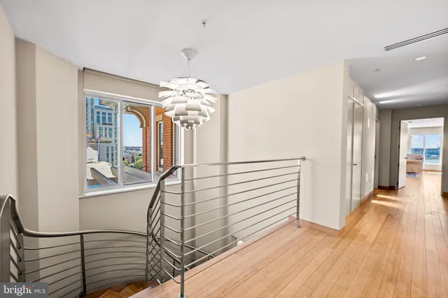 a view of a swimming pool with outdoor seating