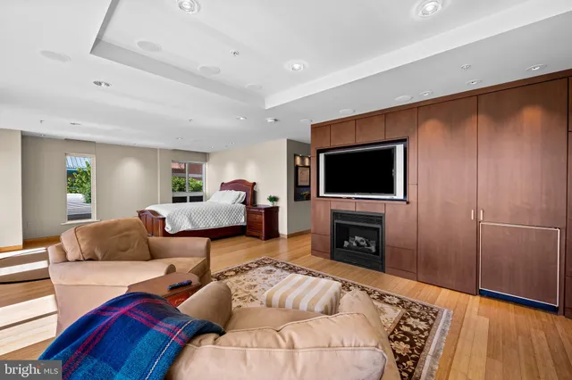an aerial view of a house with a swimming pool patio and outdoor seating