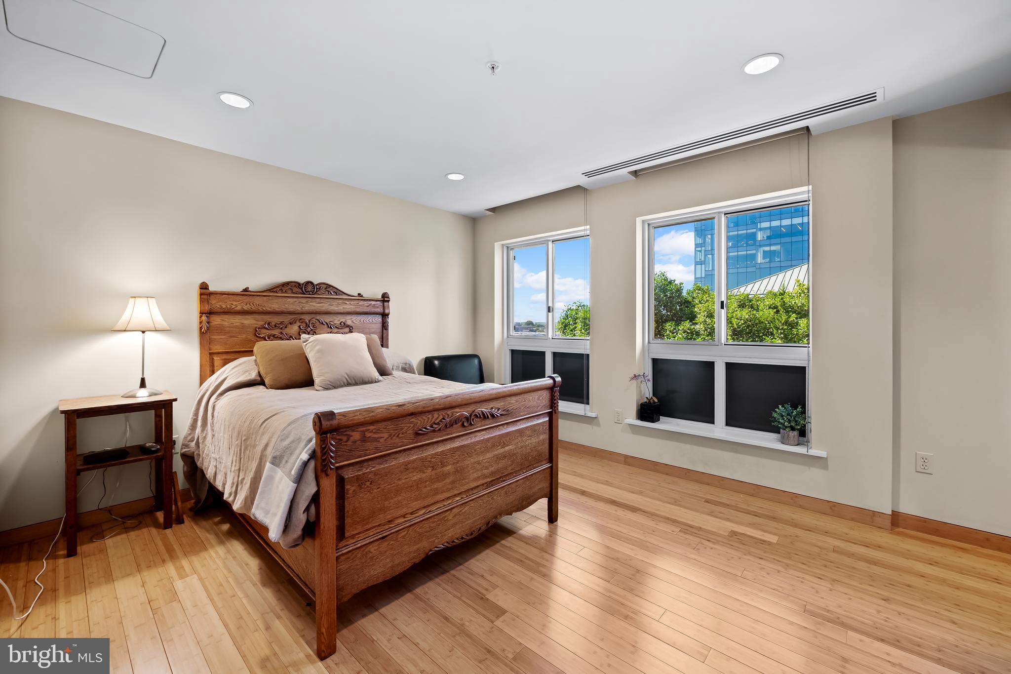 717 President Street, Unit PH802 Baltimore, MD 21202 - Photo 44 of 77 a bed room with a bed and a window