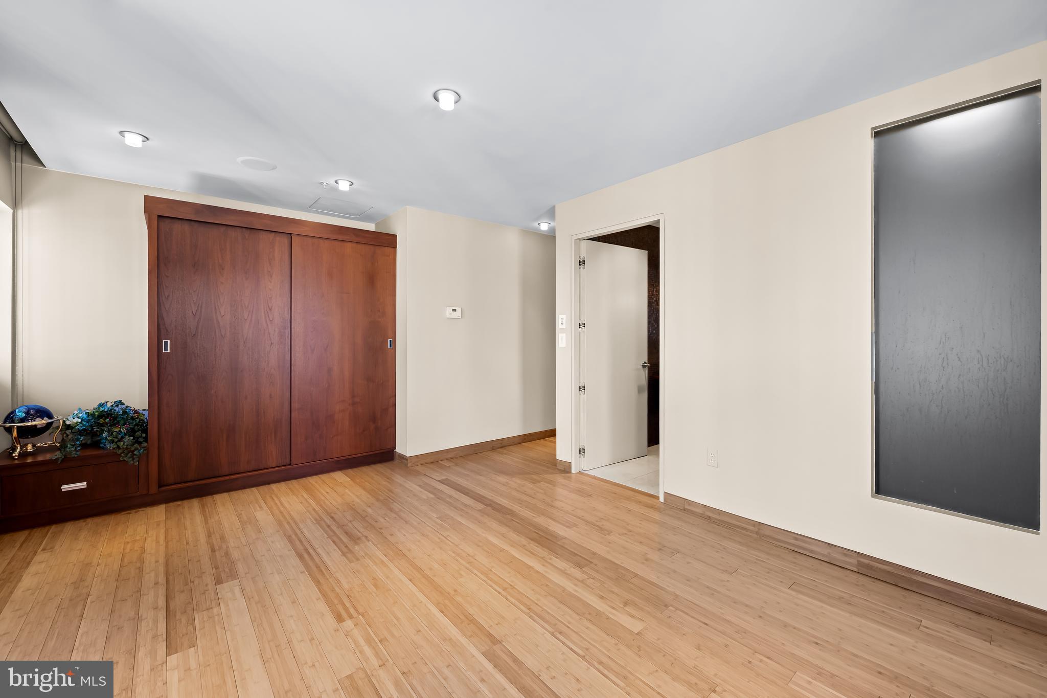 717 President Street, Unit PH802 Baltimore, MD 21202 - Photo 48 of 77 a view of an empty room with wooden floor and closet