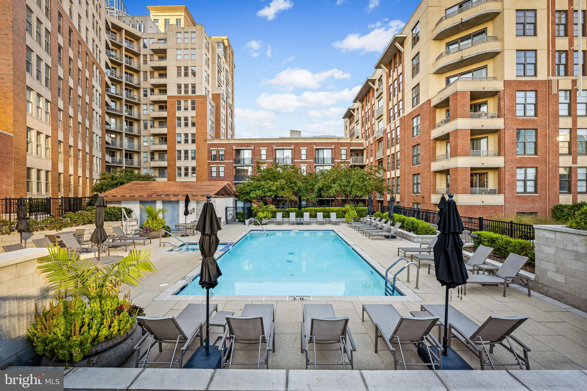 717 President Street, Unit PH802 Baltimore, MD 21202 - Photo 53 of 77 a view of a swimming pool with outdoor seating and plants