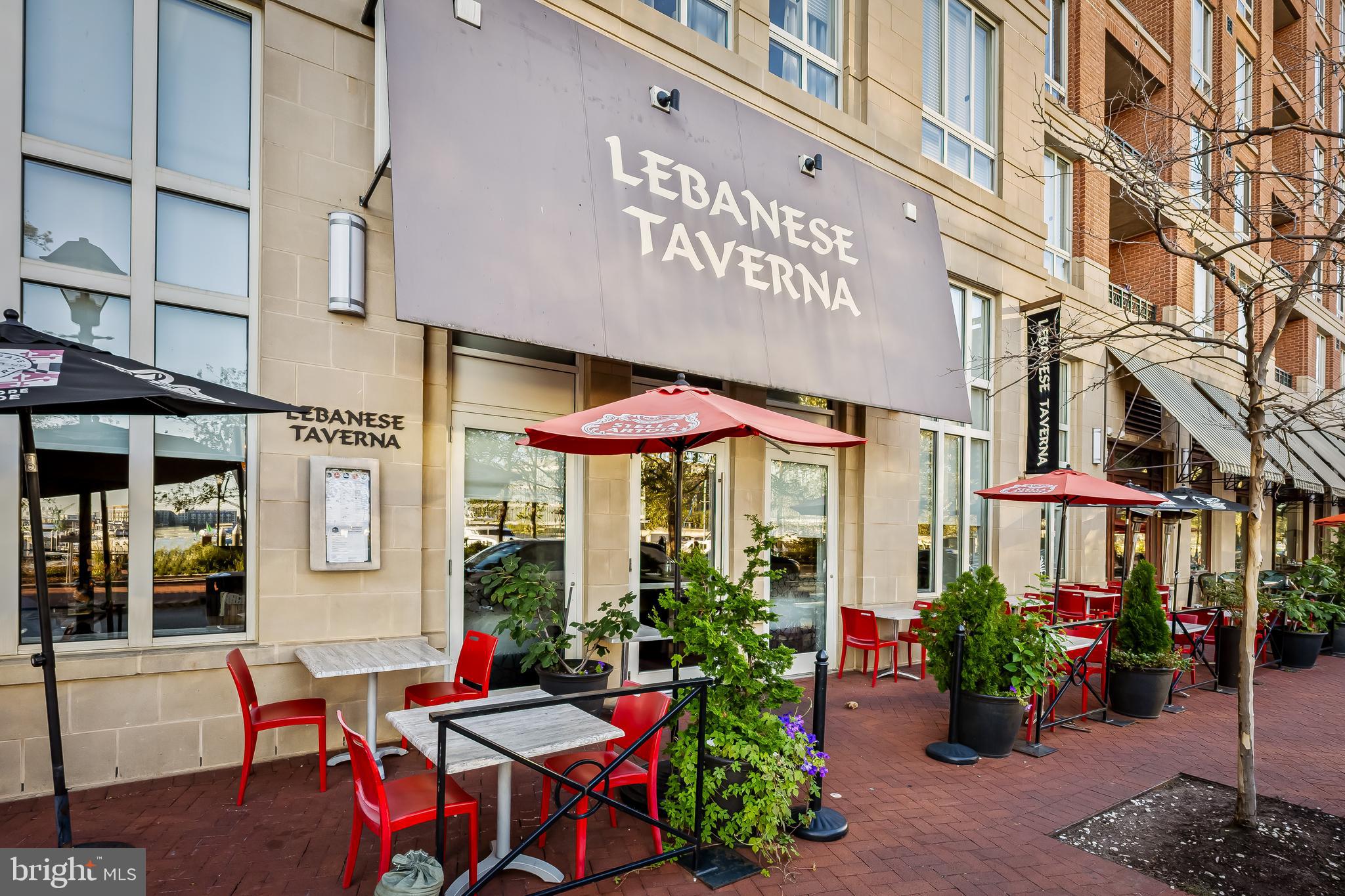 717 President Street, Unit PH802 Baltimore, MD 21202 - Photo 74 of 77 a view of a cafe with a couple of people seating