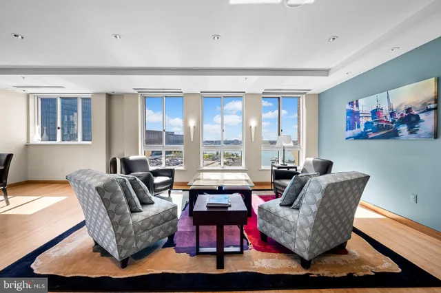 a kitchen with stainless steel appliances kitchen island granite countertop a stove and a refrigerator