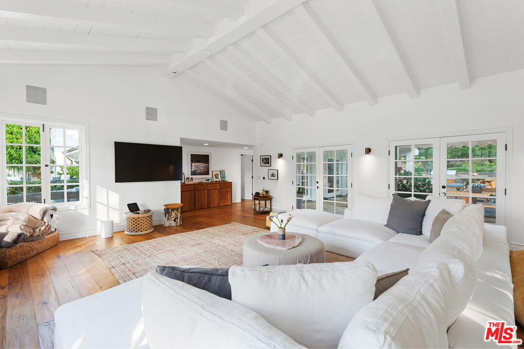 6238 Bonsall Drive Malibu, CA 90265 - Photo 13 of 40 a living room with furniture and a flat screen tv
