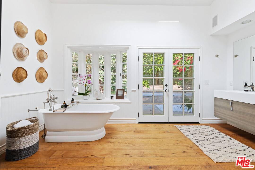 6238 Bonsall Drive Malibu, CA 90265 - Photo 16 of 40 a bathroom with a bathtub and a sink
