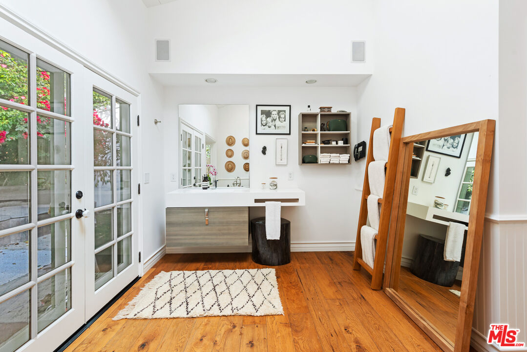 6238 Bonsall Drive Malibu, CA 90265 - Photo 17 of 40 a kitchen with a refrigerator and cabinets