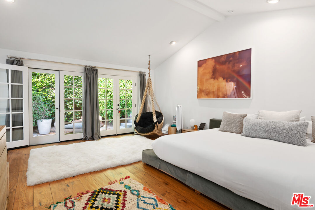 6238 Bonsall Drive Malibu, CA 90265 - Photo 19 of 40 a bedroom with two beds and a large window