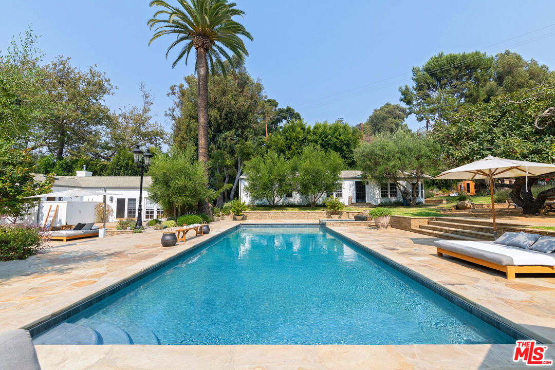 6238 Bonsall Drive Malibu, CA 90265 - Photo 26 of 40 a view of a swimming pool with lounge chair