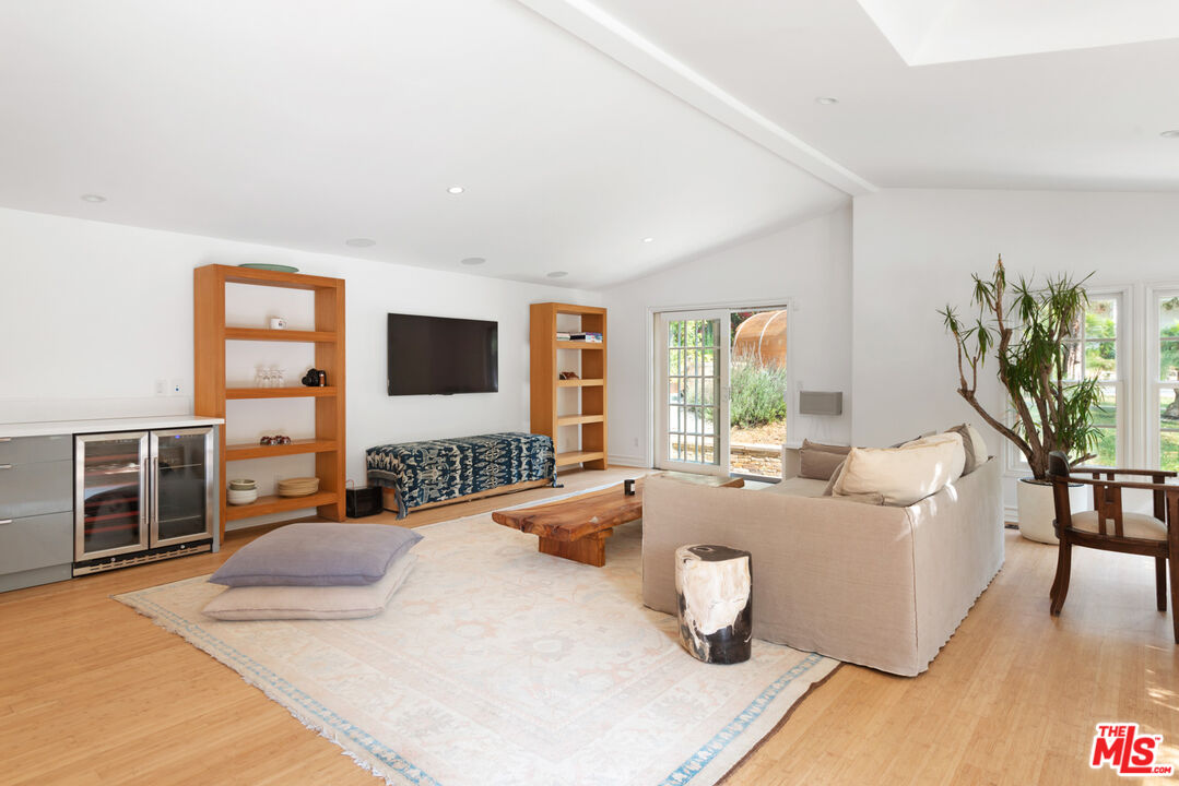 6238 Bonsall Drive Malibu, CA 90265 - Photo 29 of 40 a bedroom with a large bed and a window