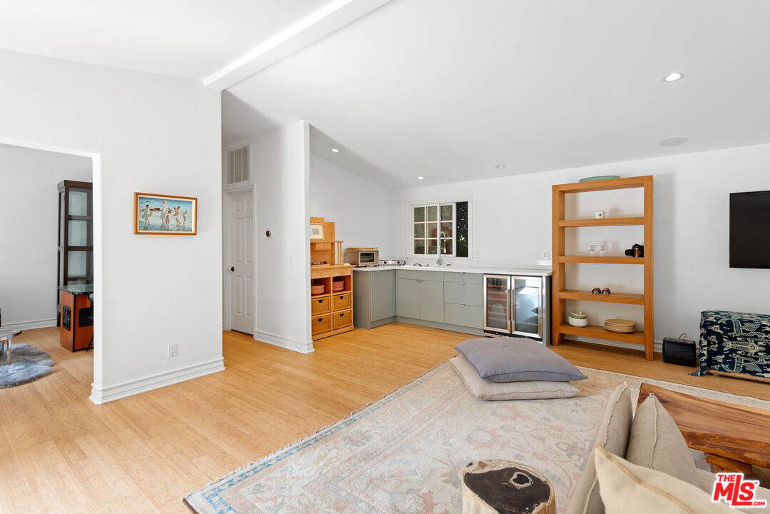 6238 Bonsall Drive Malibu, CA 90265 - Photo 30 of 40 a view of a kitchen with furniture and wooden floor