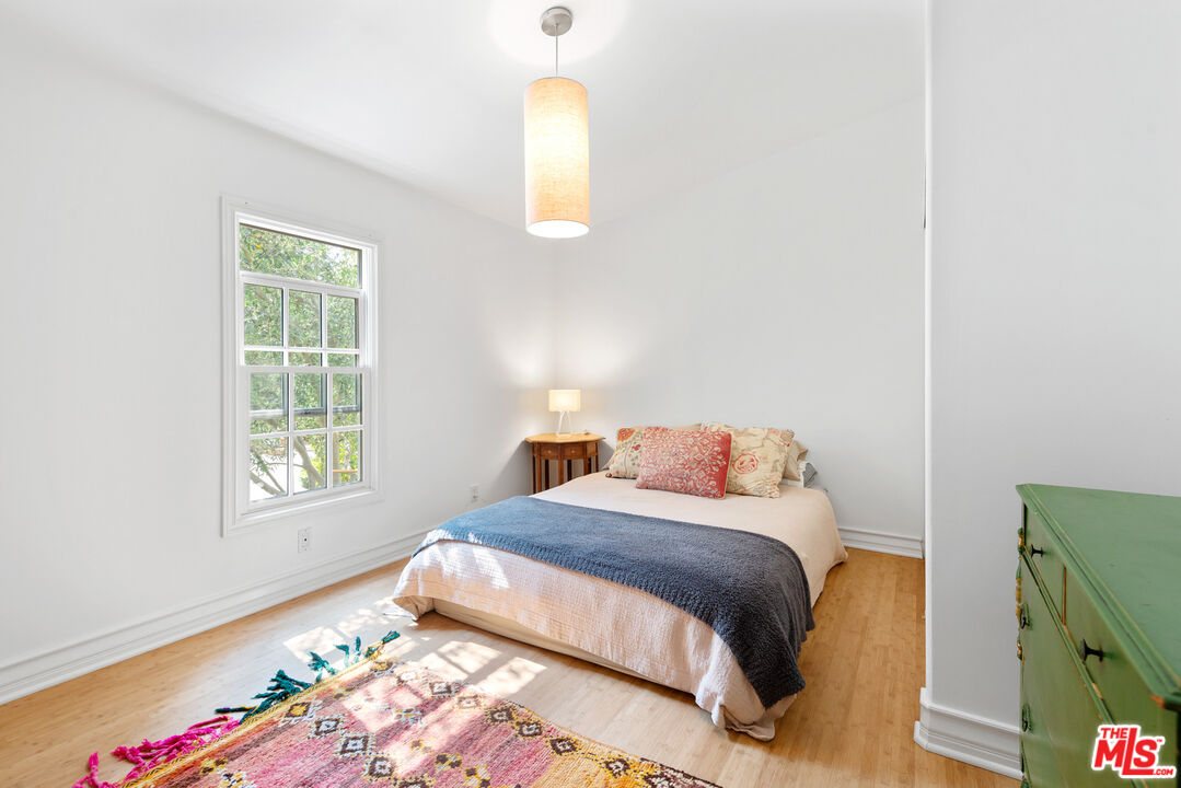 6238 Bonsall Drive Malibu, CA 90265 - Photo 31 of 40 a bedroom with a bed and a window