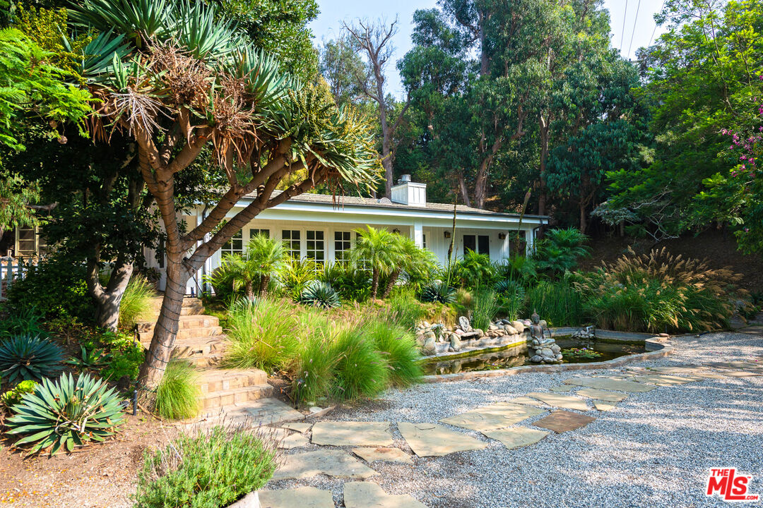 6238 Bonsall Drive Malibu, CA 90265 - Photo 37 of 40 a front view of a house with a yard