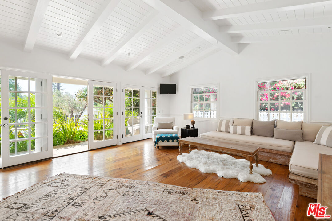 6238 Bonsall Drive Malibu, CA 90265 - Photo 38 of 40 a living room with furniture and a large window