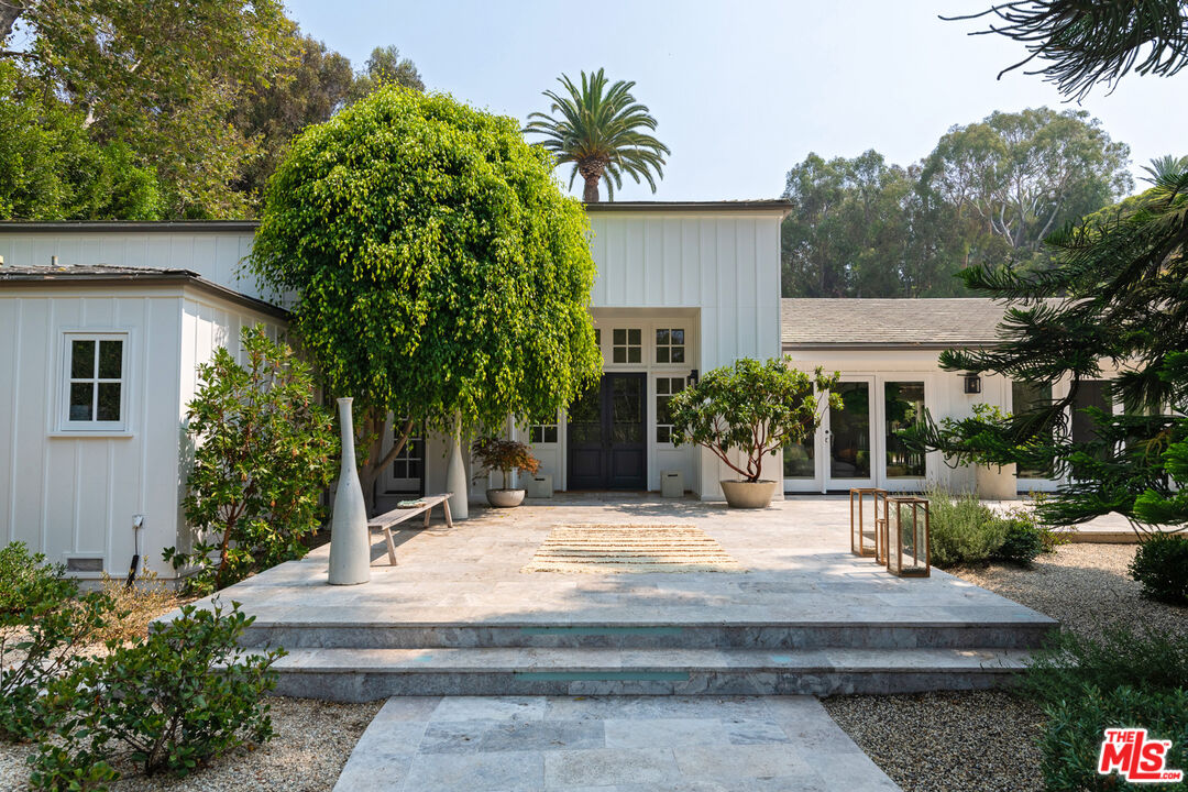 6238 Bonsall Drive Malibu, CA 90265 - Photo 5 of 40 a view of house with outdoor space and garden