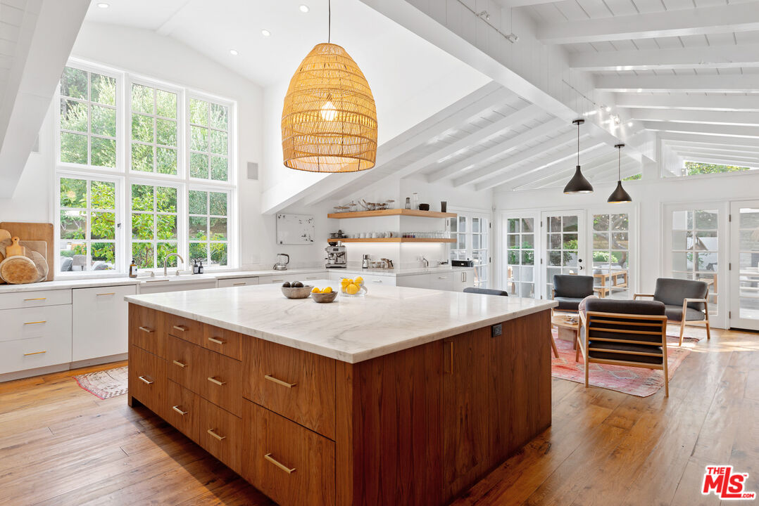 6238 Bonsall Drive Malibu, CA 90265 - Photo 10 of 40 a kitchen with wooden cabinets and window