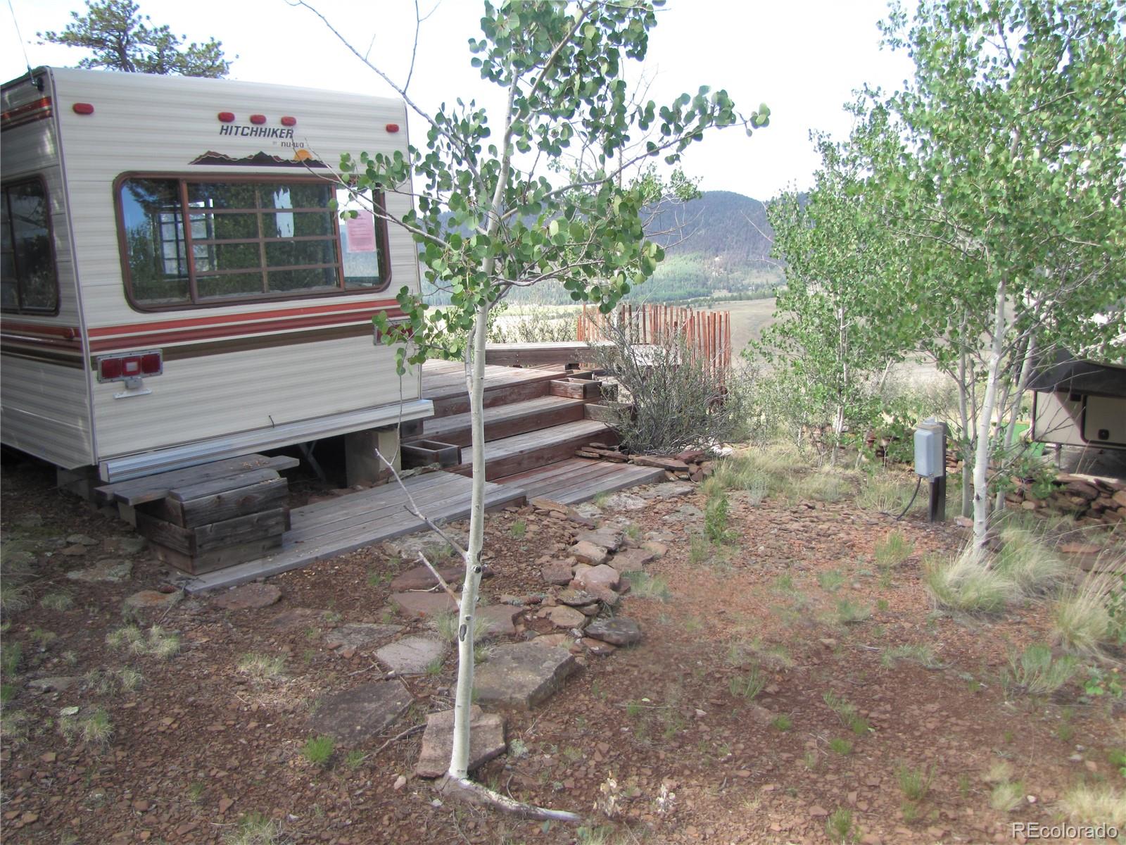 1808 Narrow Gauge Road Fairplay, CO 80440 - Photo 12 of 33 a view of a house with a yard and wooden fence