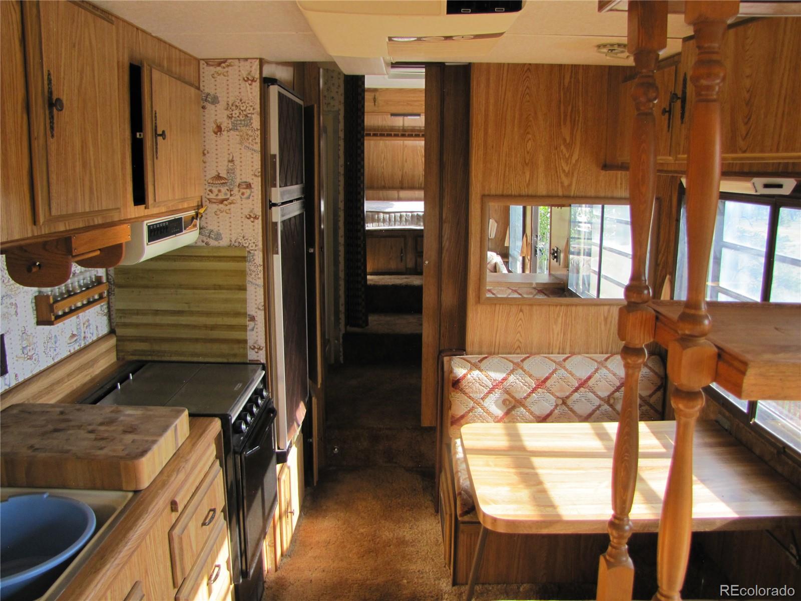 1808 Narrow Gauge Road Fairplay, CO 80440 - Photo 22 of 33 a kitchen with a refrigerator and a stove