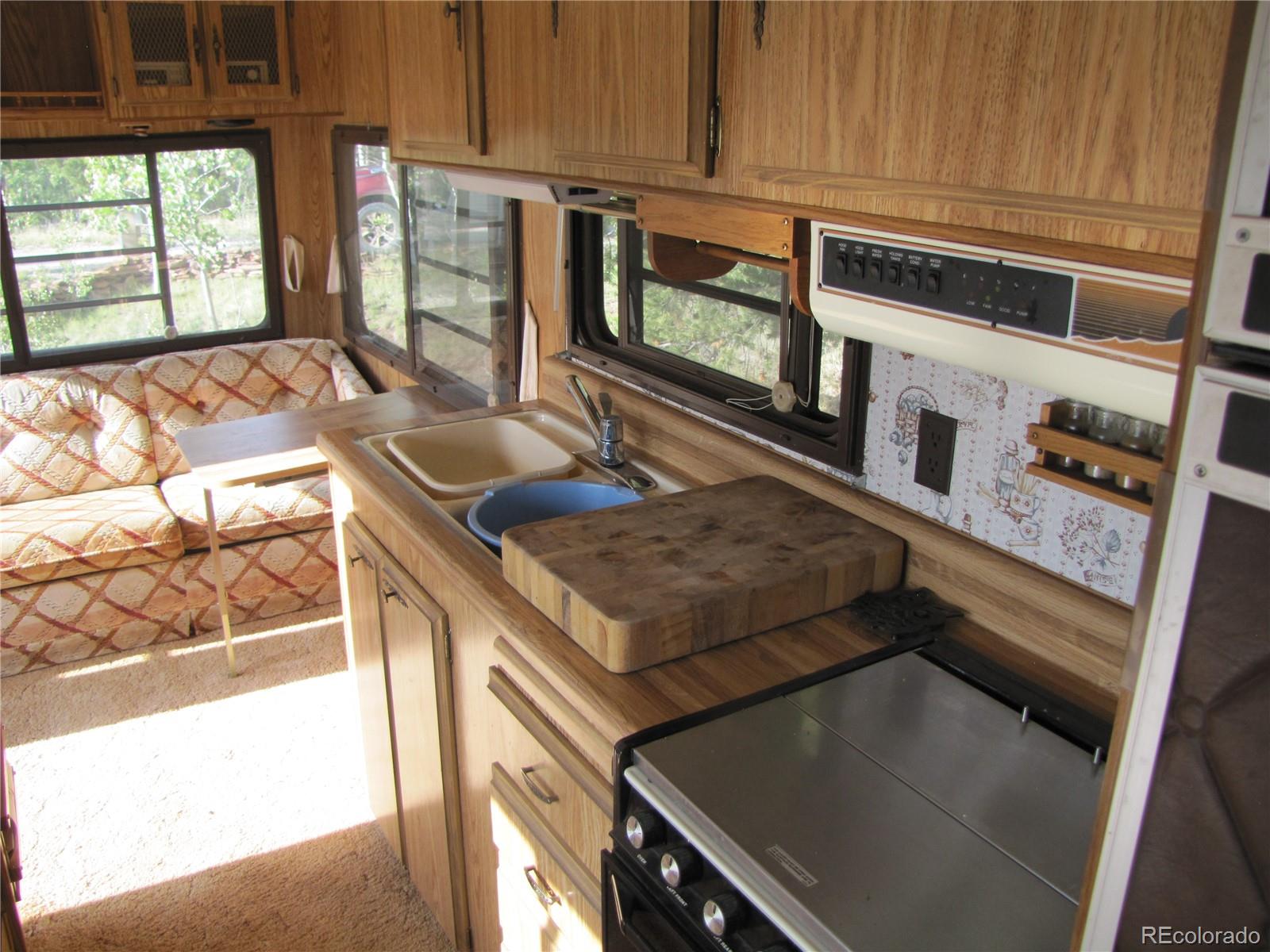 1808 Narrow Gauge Road Fairplay, CO 80440 - Photo 27 of 33 a kitchen with stainless steel appliances granite countertop a sink and a stove