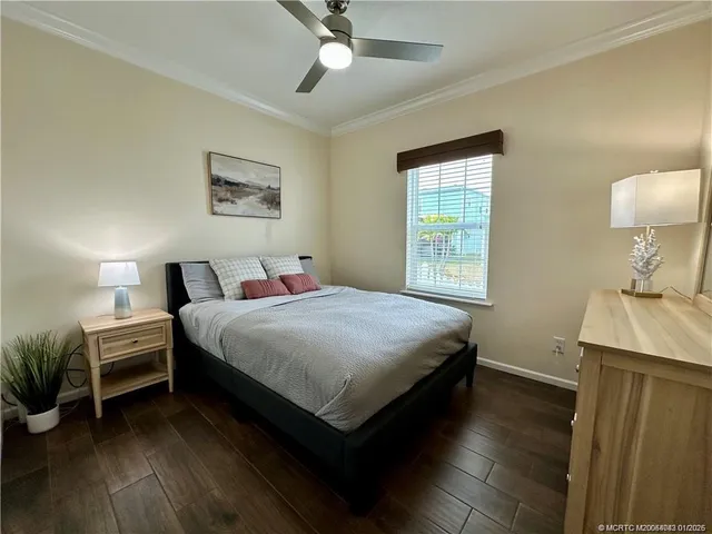 a bedroom with a bed and a table