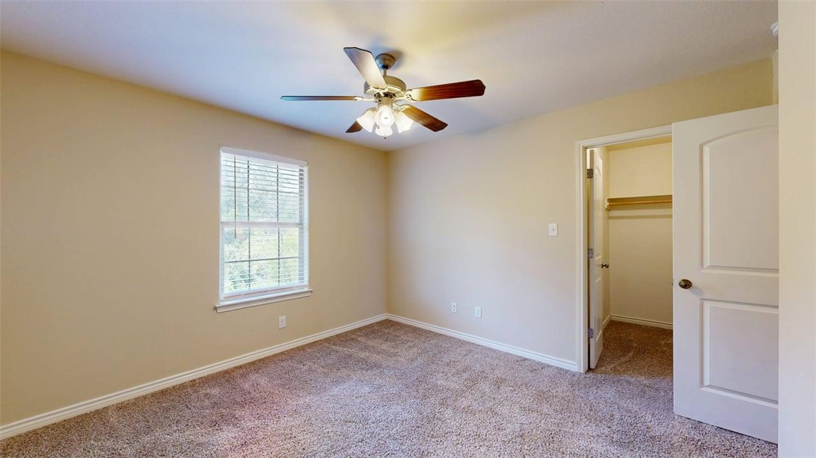 4436 Reveille Road College Station, TX 77845 - Photo 16 of 31 an empty room with windows and fan