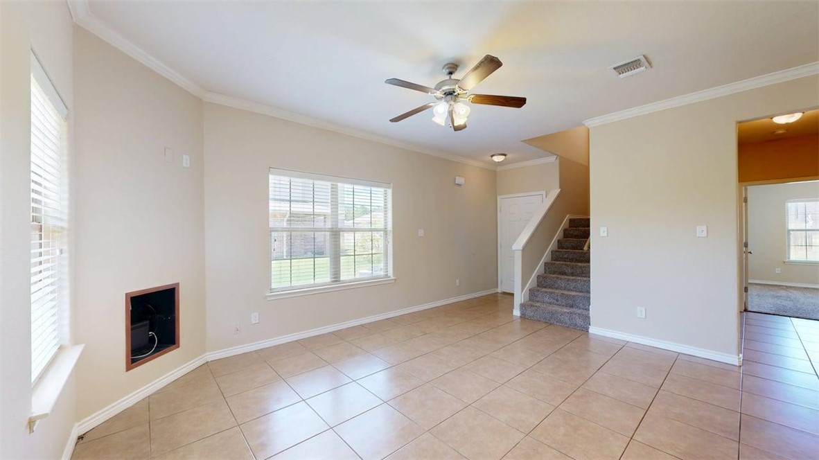 4436 Reveille Road College Station, TX 77845 - Photo 2 of 31 a view of an empty room with wooden floor and a window