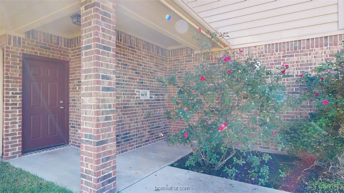 4436 Reveille Road College Station, TX 77845 - Photo 28 of 31 a potted plant sitting in front of a door