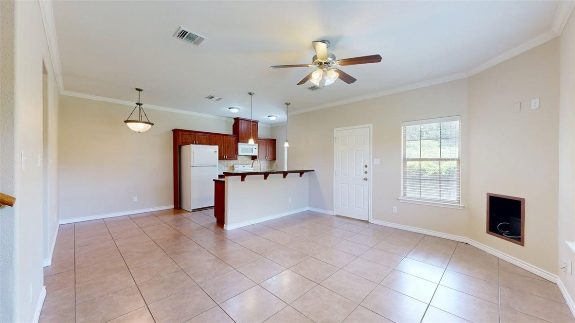 4436 Reveille Road College Station, TX 77845 - Photo 3 of 31 a view of a livingroom with a chandelier fan and windows