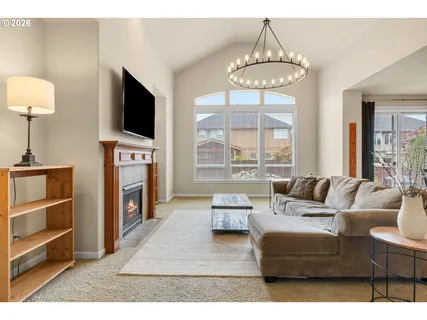 a living room with furniture a dining table and kitchen view