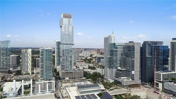 a view of city with tall buildings