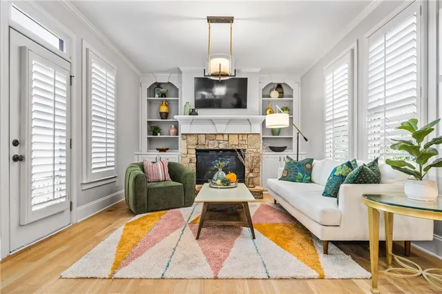 a dining room with furniture a rug and a window
