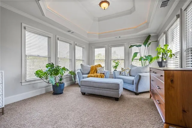 a bathroom with a tub a sink and a large mirror