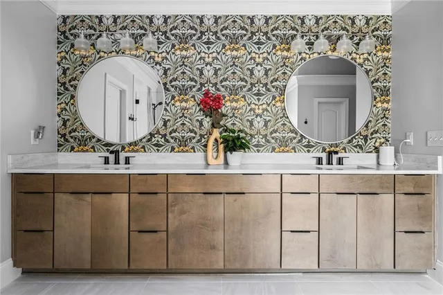 a spacious bedroom with a bed and a chandelier