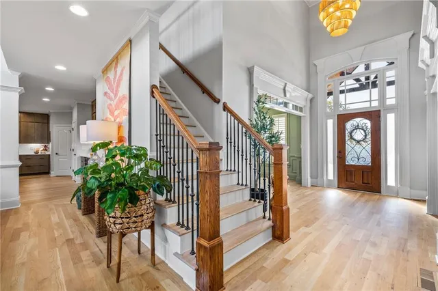 a kitchen with kitchen island granite countertop a sink and cabinets