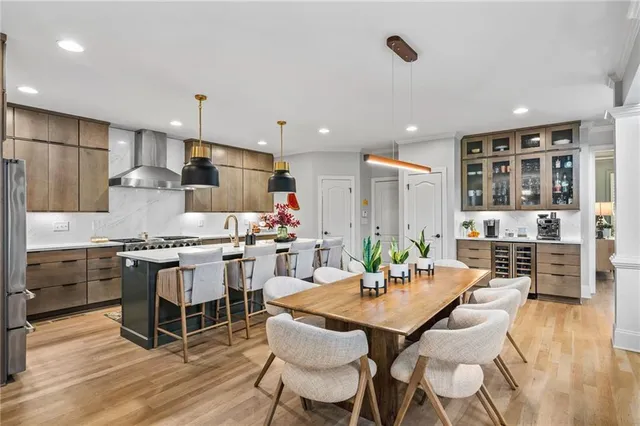 a kitchen with stainless steel appliances a sink a stove and a refrigerator