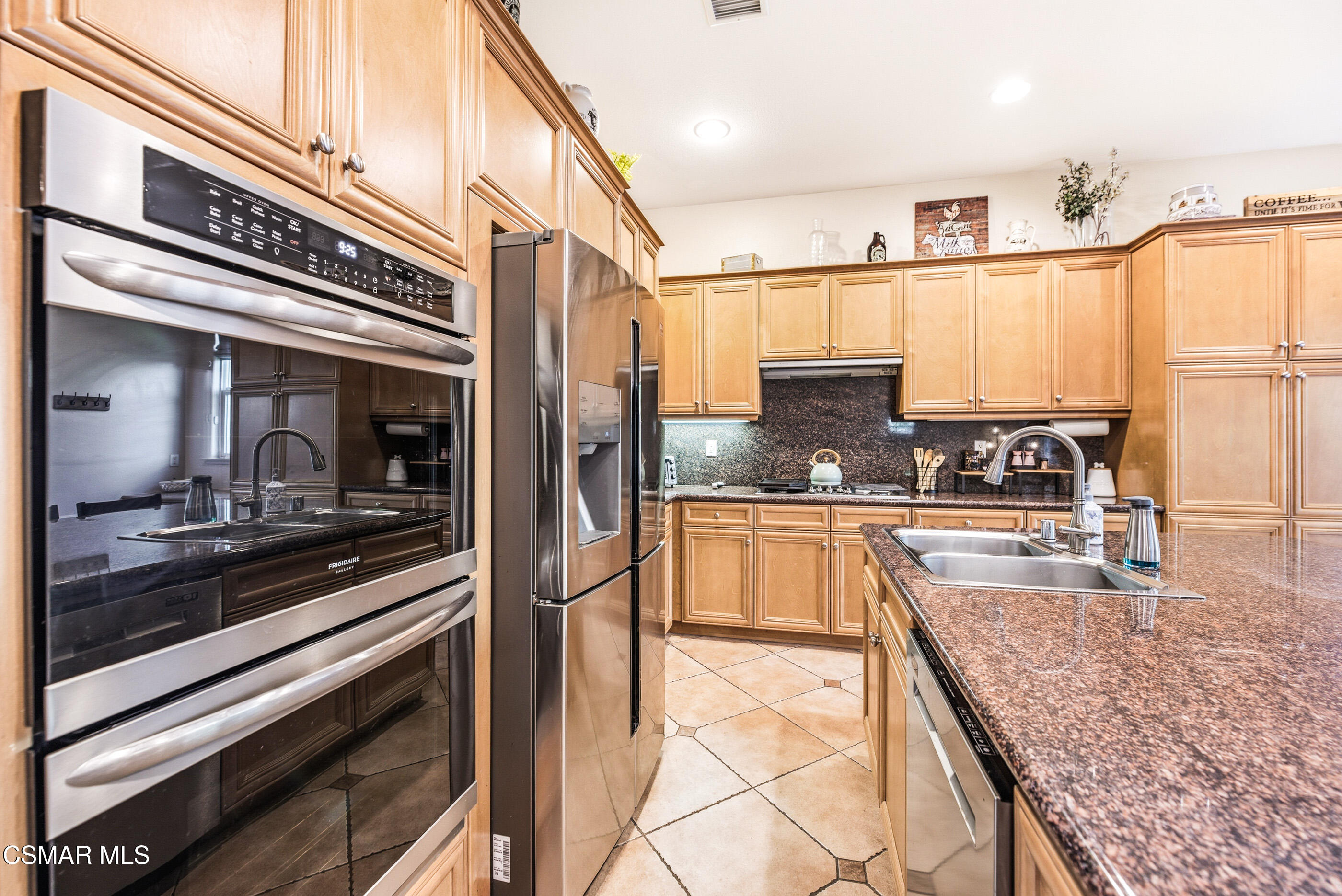 4741 Westwood Street Simi Valley, CA 93063 - Photo 12 of 48 a kitchen with stainless steel appliances granite countertop a sink and cabinets