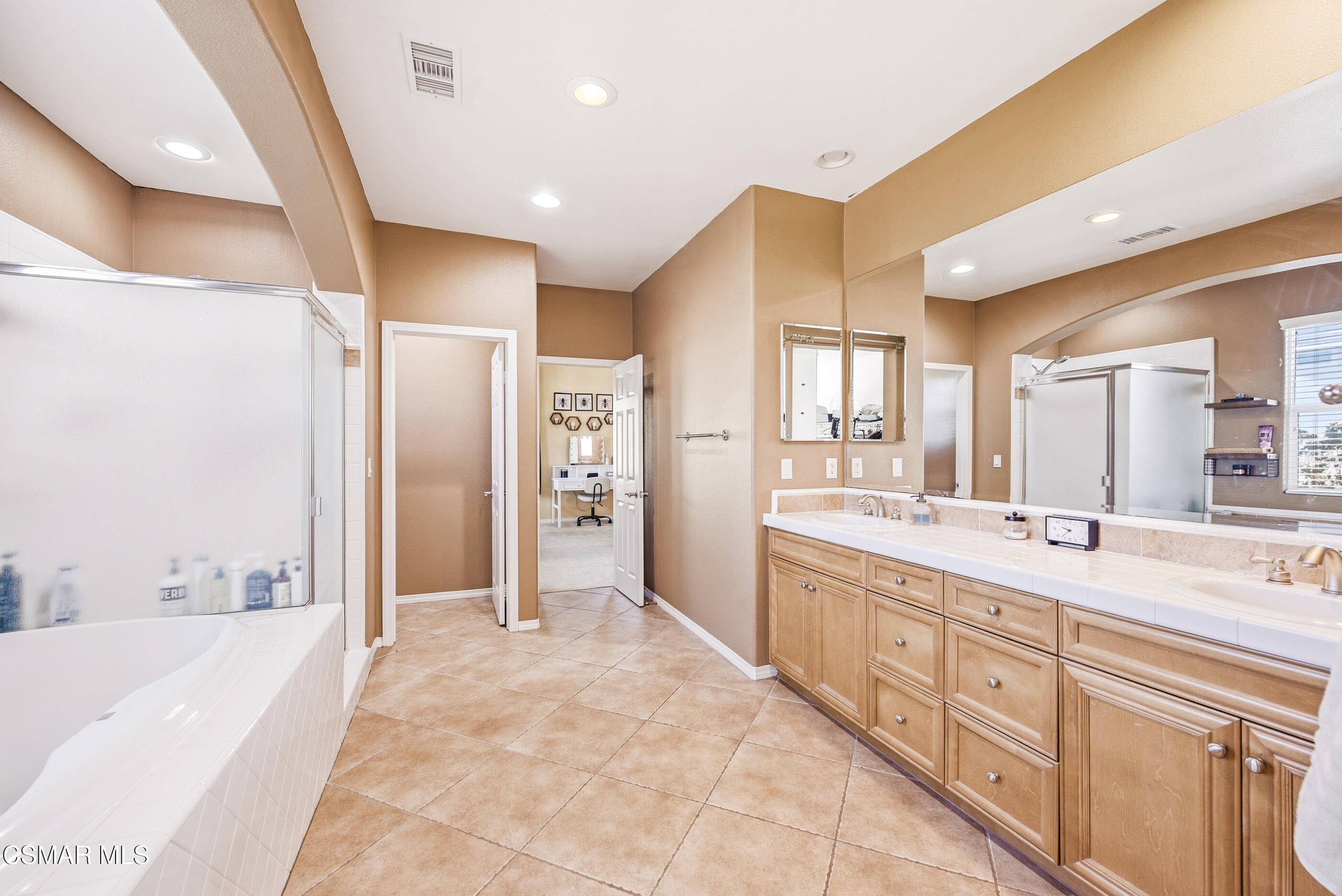 4741 Westwood Street Simi Valley, CA 93063 - Photo 27 of 48 a spacious bathroom with a double vanity sink a mirror and a bathtub