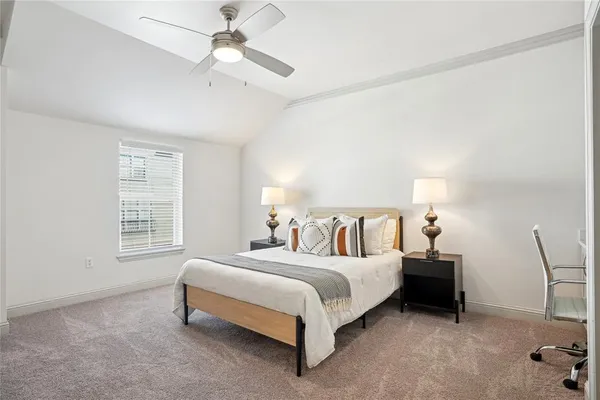 a bed room with a bed and a chair