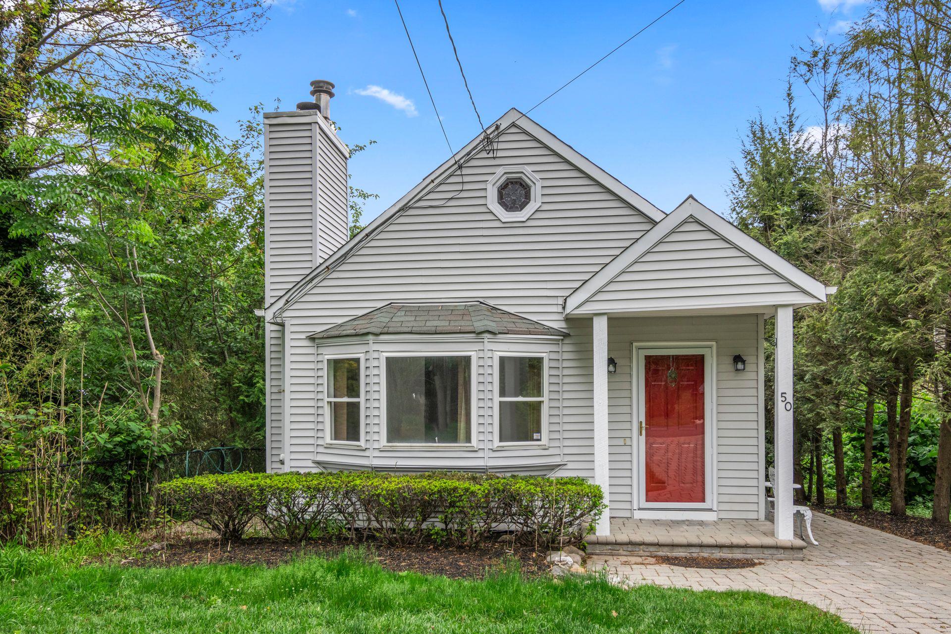 50 Aloma Road Rocky Point, NY 11778 - Photo 1 of 1 View of front of home featuring a chimney