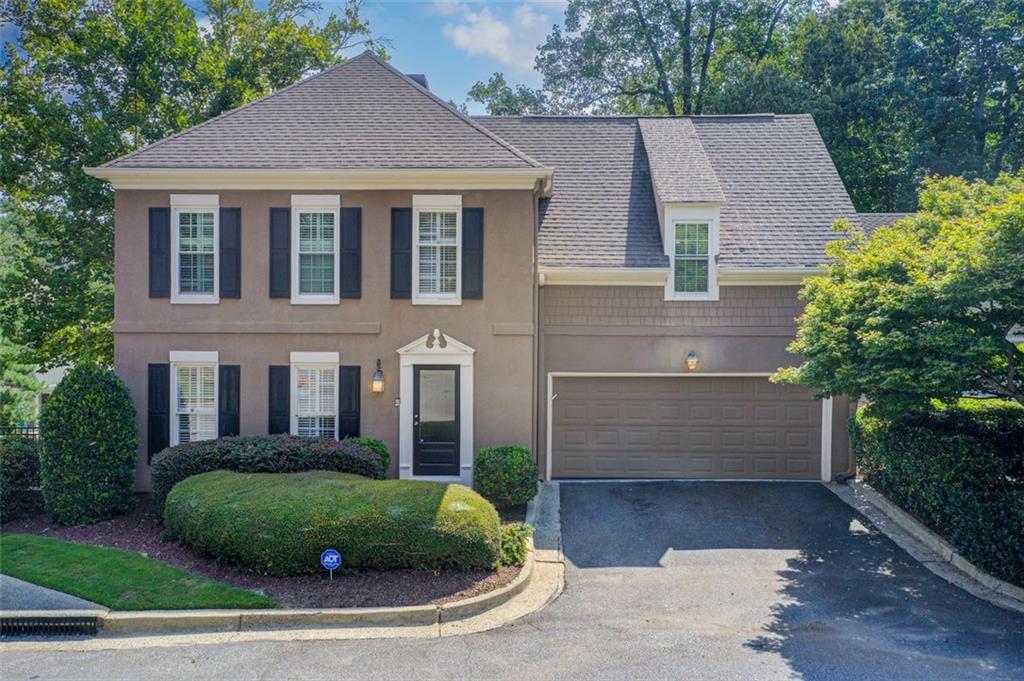 13 Ridgemere Trace Sandy Springs, GA 30328 - Photo 1 of 1 a front view of a house with a yard