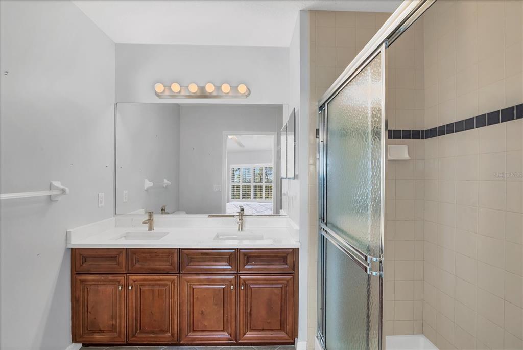 8413 Placida Road, Unit 308 Placida, FL 33946 - Photo 17 of 40 a bathroom with a sink and a mirror