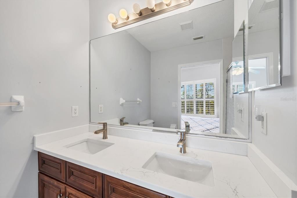 8413 Placida Road, Unit 308 Placida, FL 33946 - Photo 18 of 40 a bathroom with a sink and a mirror