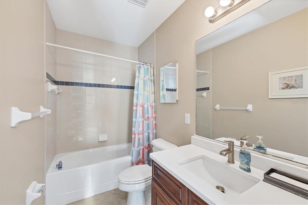 8413 Placida Road, Unit 308 Placida, FL 33946 - Photo 22 of 40 a bathroom with a sink toilet and shower