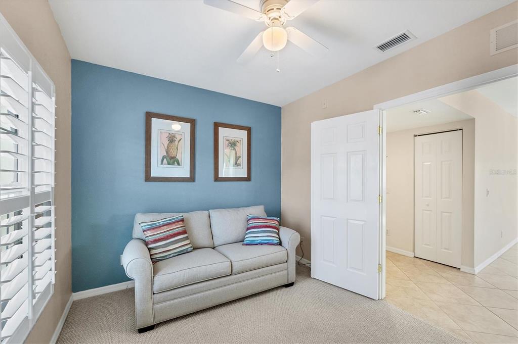 8413 Placida Road, Unit 308 Placida, FL 33946 - Photo 24 of 40 a living room with furniture and a window