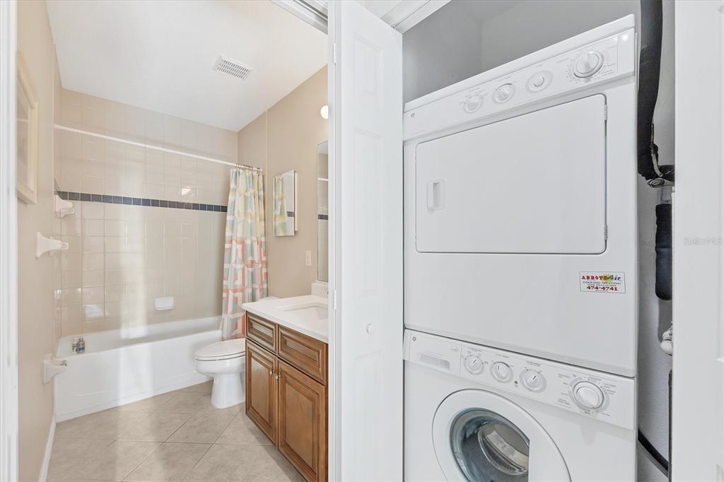 8413 Placida Road, Unit 308 Placida, FL 33946 - Photo 25 of 40 a bathroom with a granite countertop sink mirror vanity and toilet
