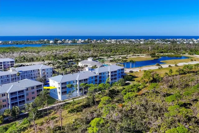 a view of a street with a building and a street sign