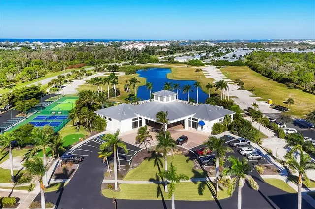 a view of a chairs and table in patio with a garden