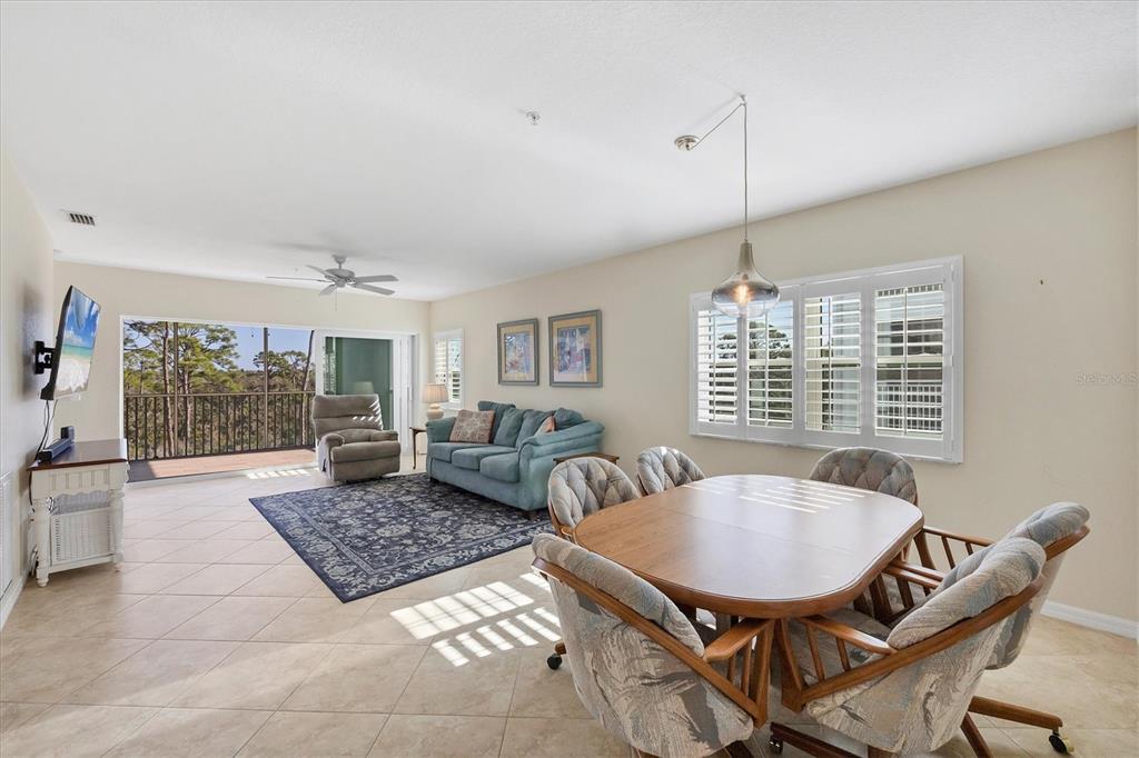 8413 Placida Road, Unit 308 Placida, FL 33946 - Photo 4 of 40 a living room with furniture and a table